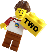 Lego mini fig man holding a block