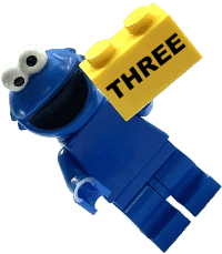 Lego cookie monster holding a block